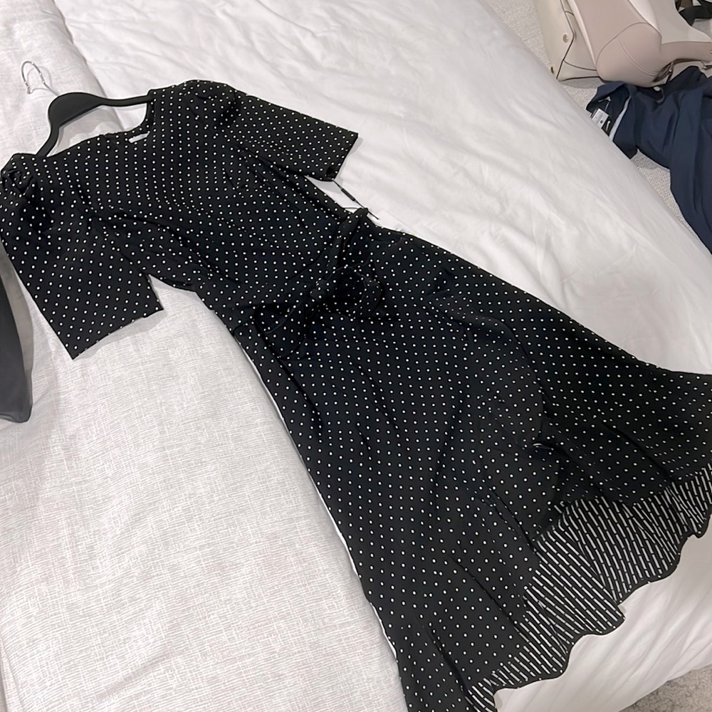 Calvin Klein Ruffled Tulip Hem Polka Dot tie dress in black with white dots.